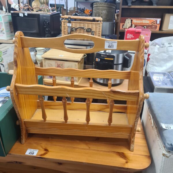 Rustic pine magazine rack for home storage and display.