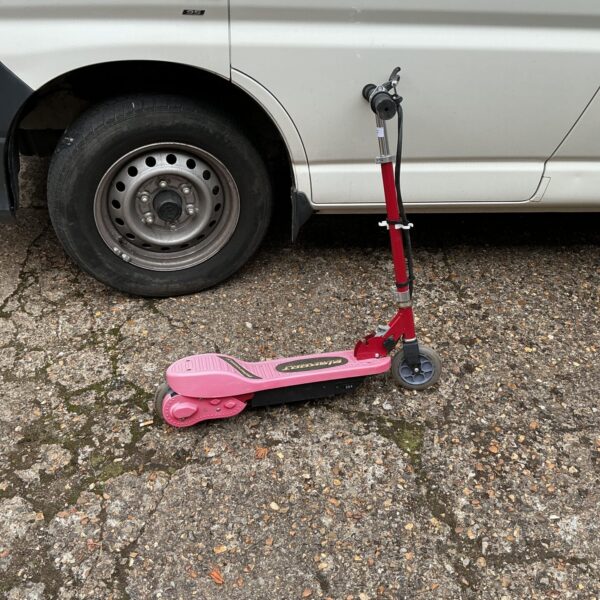 Pink Elskoot electric scooter, foldable and untested.
