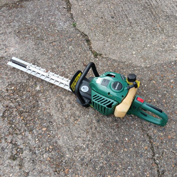 Used Qualcast petrol hedge cutter for garden trimming.