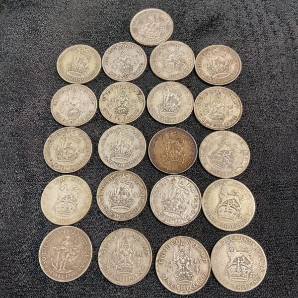 Lot of twenty-one vintage silver shillings from 1922-1946.