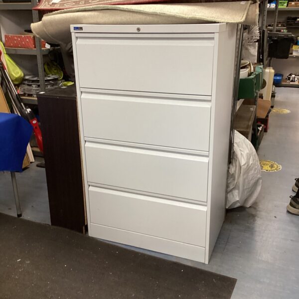 Large silver metal filing cabinet with multiple drawers for office storage.