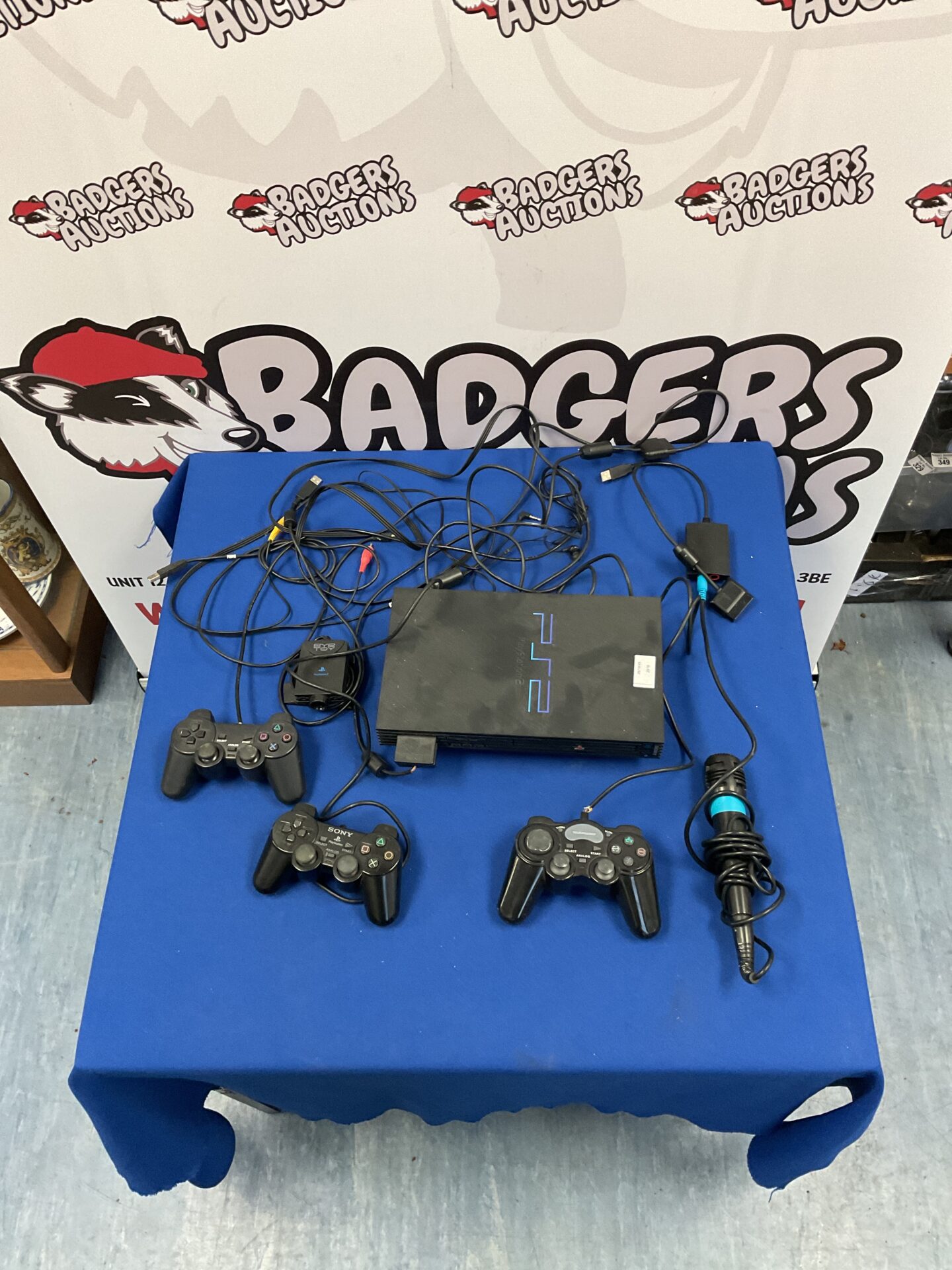 103 Sony Playstation 2 console with remotes and singstar mic