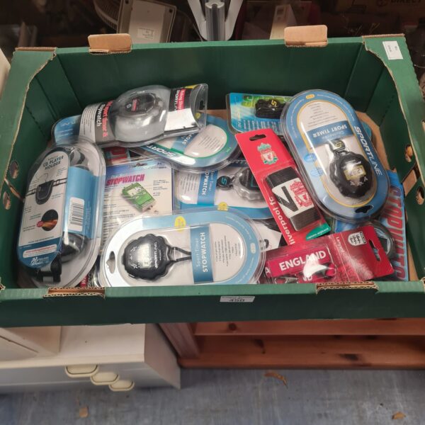 New sports memorabilia lot including stopwatches and Liverpool armband.