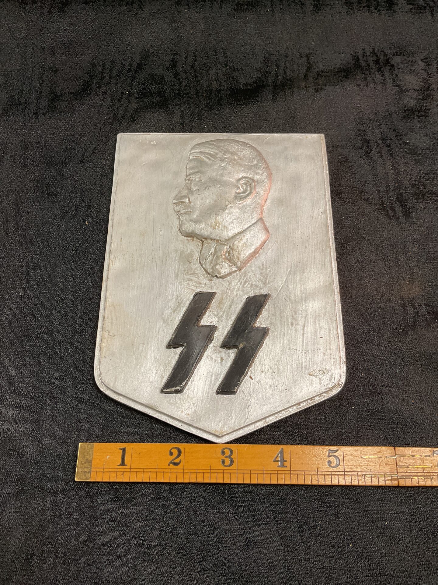 907 Rare W.W.2 ceramic shield Depicting Hitlers head above ss runes