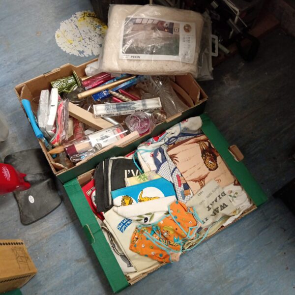 Vintage tea towels and candles presented in a mixed lot.