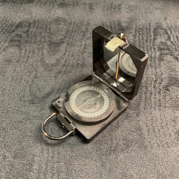 Open vintage T.G & Co. magnetic marching compass, Mark 1.