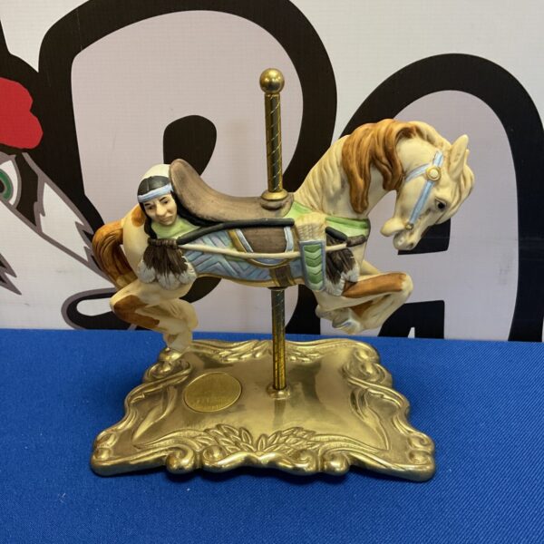 Detailed Tobin Fraley carousel horse ornament with intricate design.