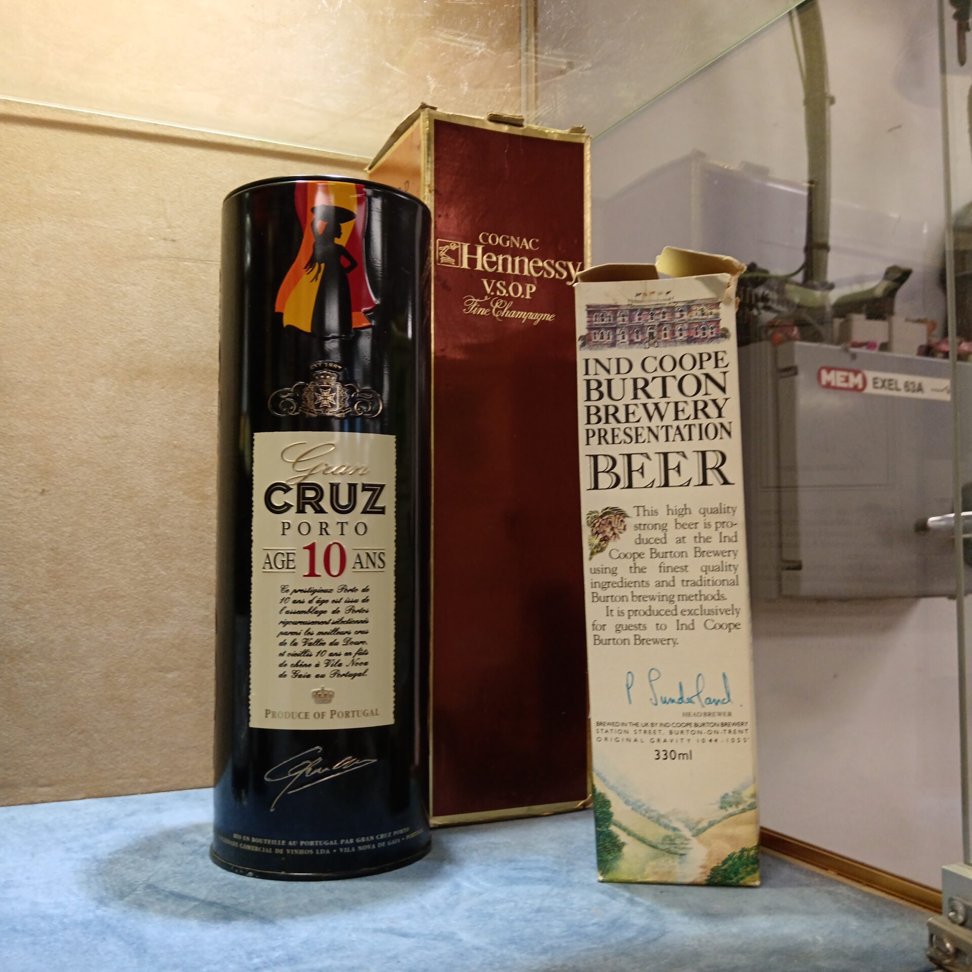 958 Three bottles of alcohol including Hennessy cognac, gran Cruz Porto & Burton brewery beer