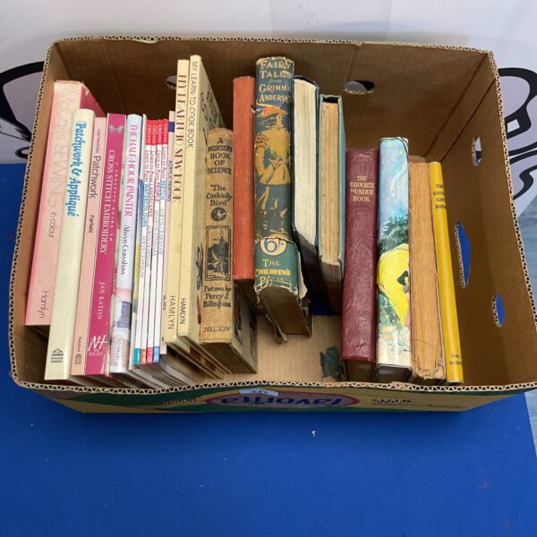 Mixed vintage books including fairy tales and Victorian guides.