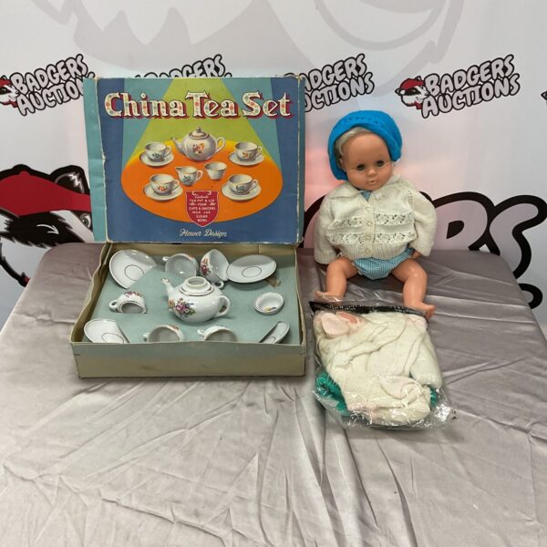 Vintage childrens tea set with Tiny Tears doll, collectible toy.