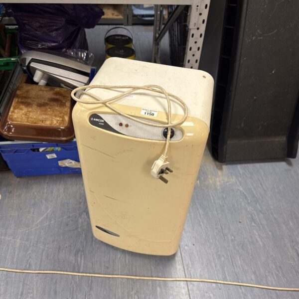 Vintage electric heater with wall mounting bracket, retro design.