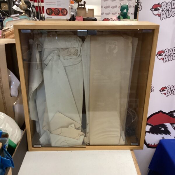 Vintage glass display cabinet for collectibles and display.