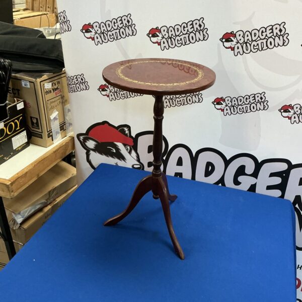 Vintage mahogany three-legged wine table in good condition.