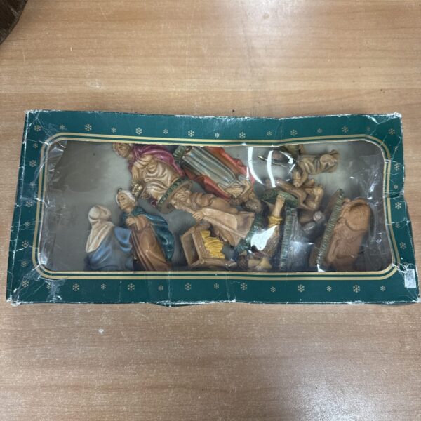 Vintage 1970s porcelain nativity set with detailed figures.