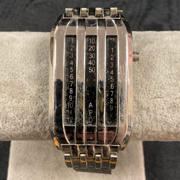 Close-up of vintage Japanese sliderule watch with sliderule function.