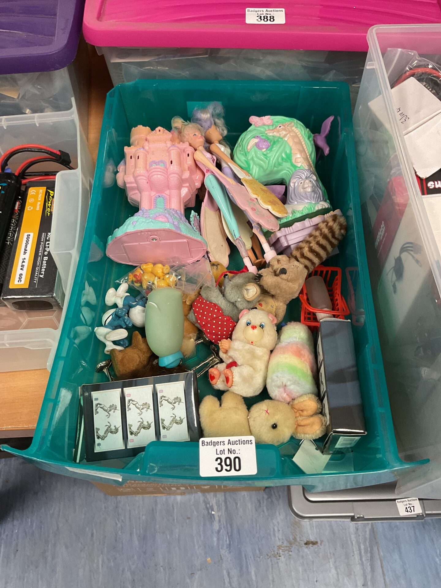 390 Box of vintage toys inc care bear pencil grabbers and flying fairies metal unicorns