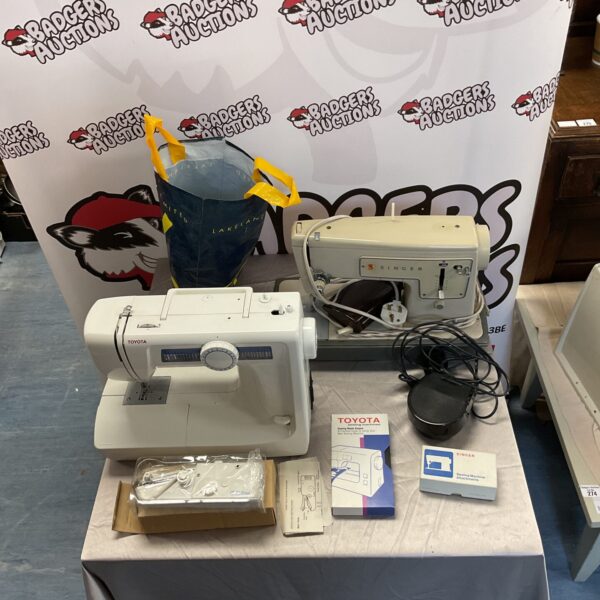 Vintage Toyota and Singer sewing machines with attachments.