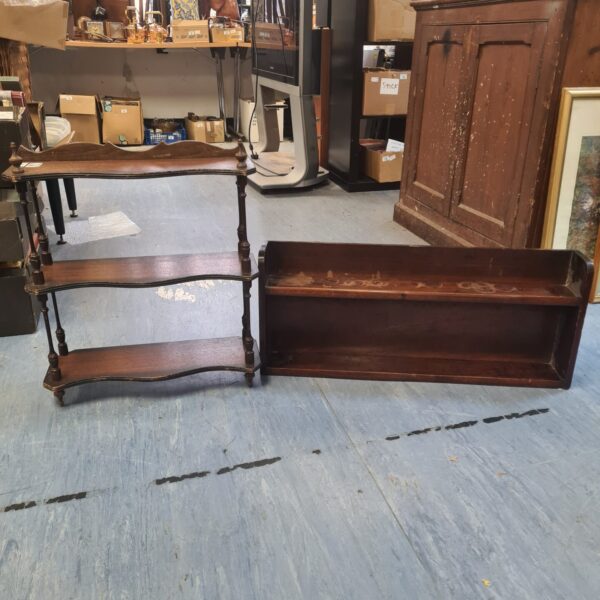 Vintage wooden tiered display shelf for collectibles and home decor.