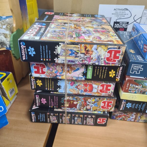 Bundle of colourful Wasjig jigsaw puzzles with large pieces.