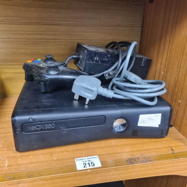 Microsoft Xbox 360 S console with controller and leads.