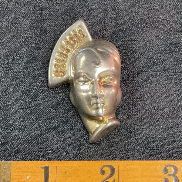 Vintage 1930s silver brooch with Art Deco sculpted face.
