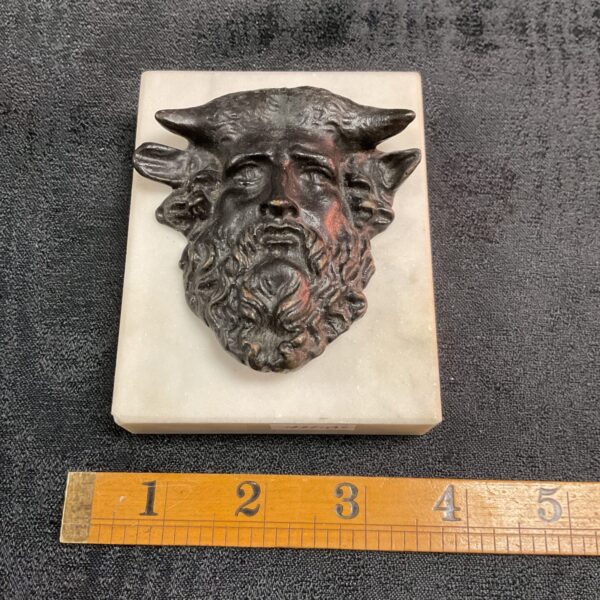 Antique bronze Acheloos head sculpture mounted on marble block.
