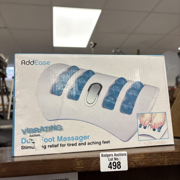 AddEase dual foot massager for relaxation and foot therapy.