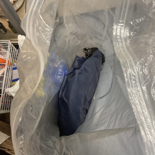 Blue airbed with pump, presented as-found for collectors.