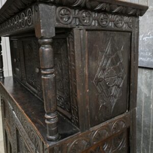 Intricately carved antique oak cabinet, 17th century English style.