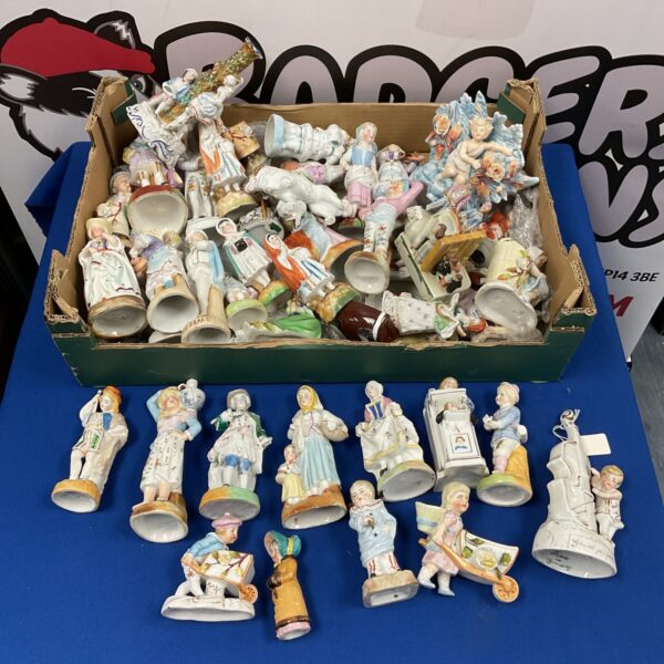 Large collection of antique German porcelain figurines on display.
