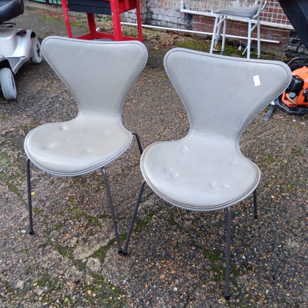 Grey vintage Arne Jacobsen Series 7 chairs with steel legs.