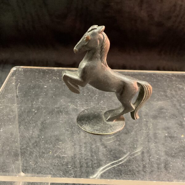 Small Austrian bronze rearing horse sculpture on display.