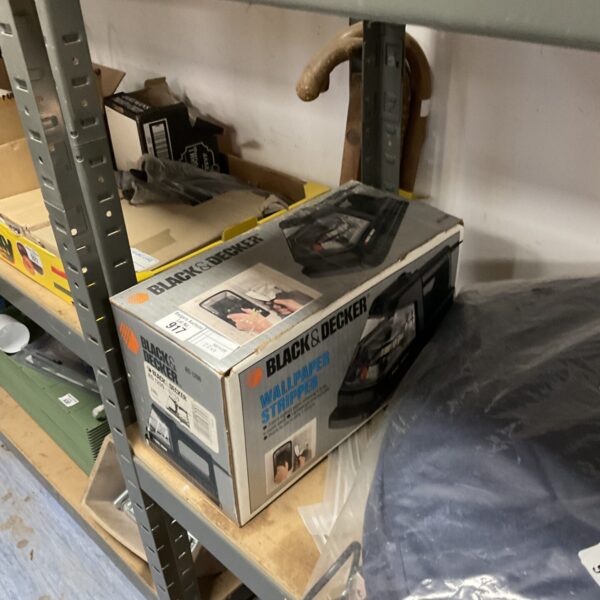 Vintage Black & Decker electric wallpaper stripper for home renovation.