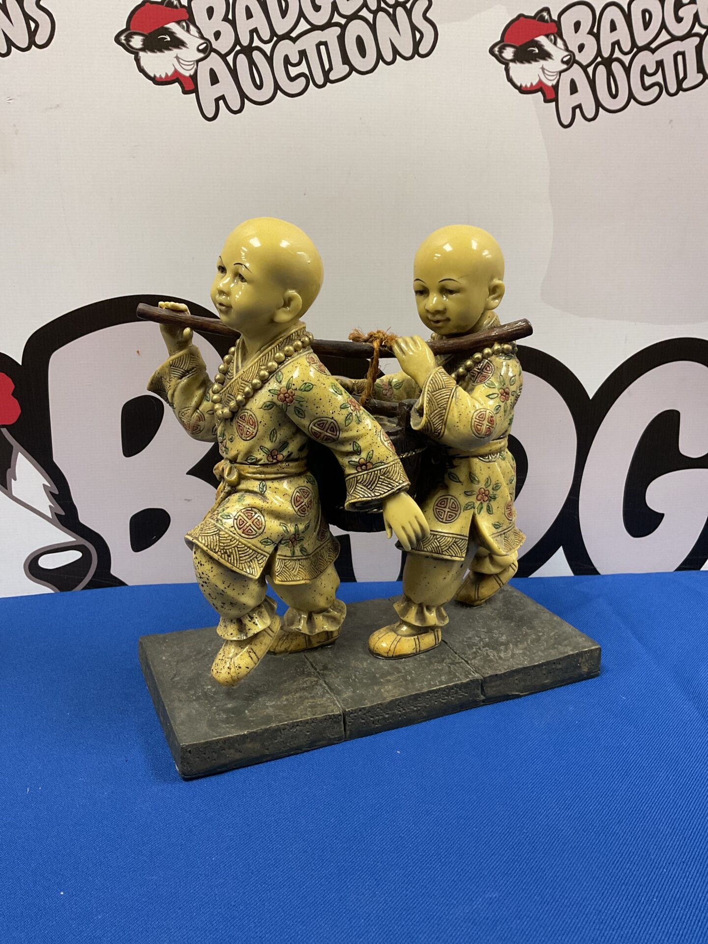 054 Pair of Buddhist boys carrying pale of water resin sculpture