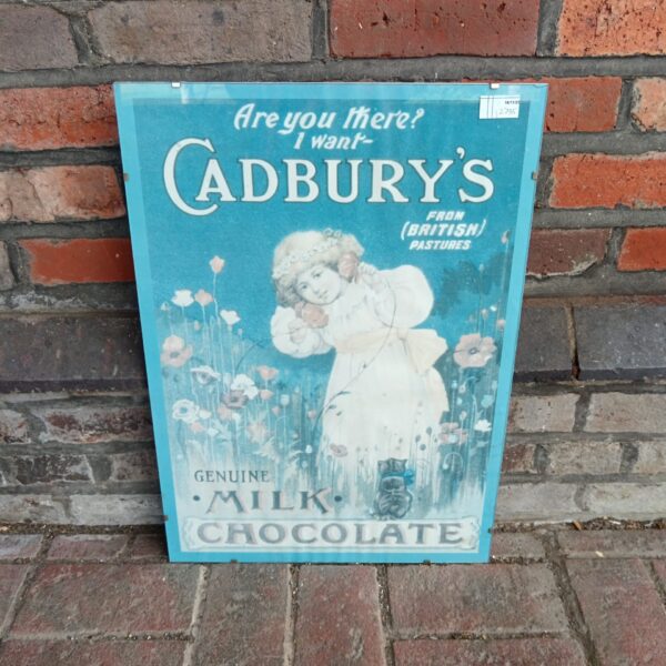Vintage Cadbury's Milk Chocolate poster with cherubic child illustration.