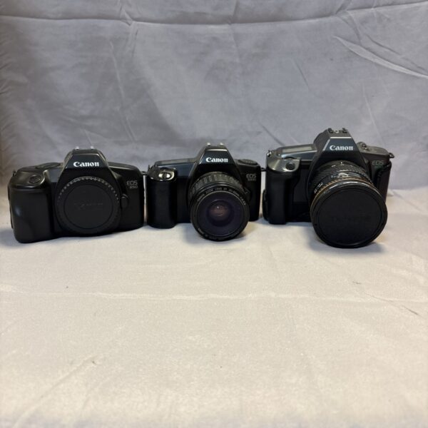 Vintage Canon Eos camera lot including models 600, 850, and 1000.