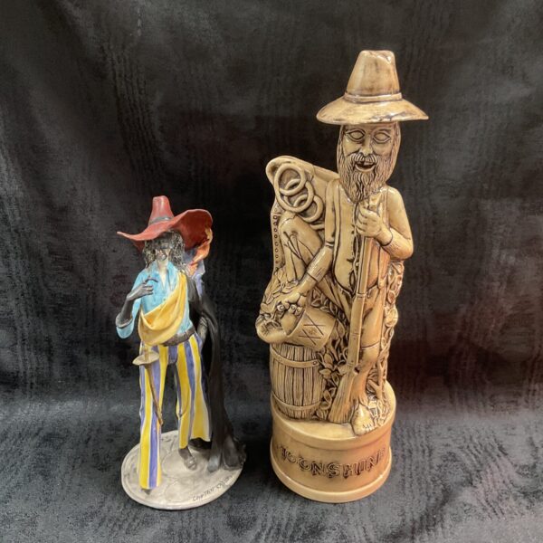 Vintage Captain Spirrelli moonshine decanter with detailed folk art design.