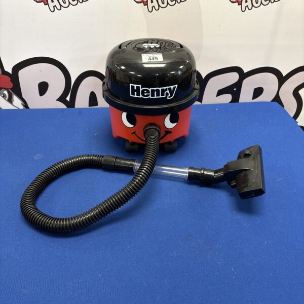 Red and black Casdon Mini Henry Hoover toy for children's play.