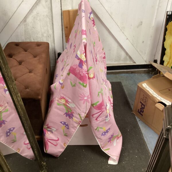 Colorful child’s play tent over a storage box.
