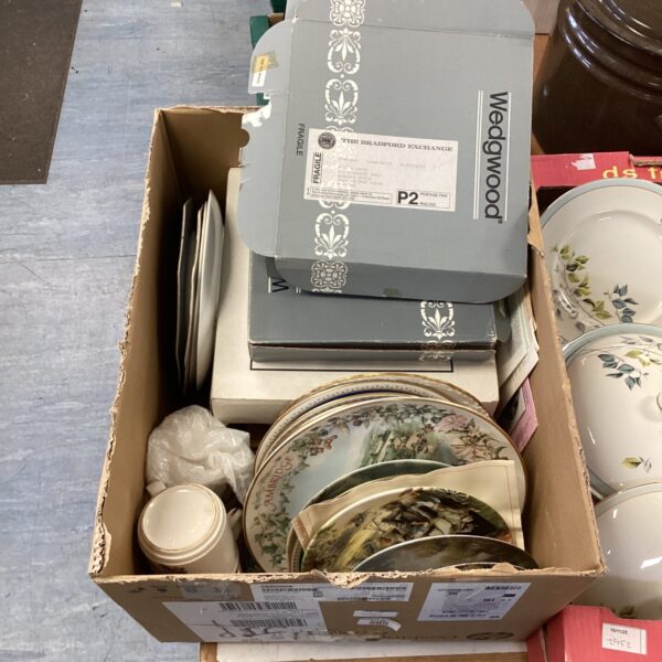 Assorted collectors plates including Wedgwood china in a box.
