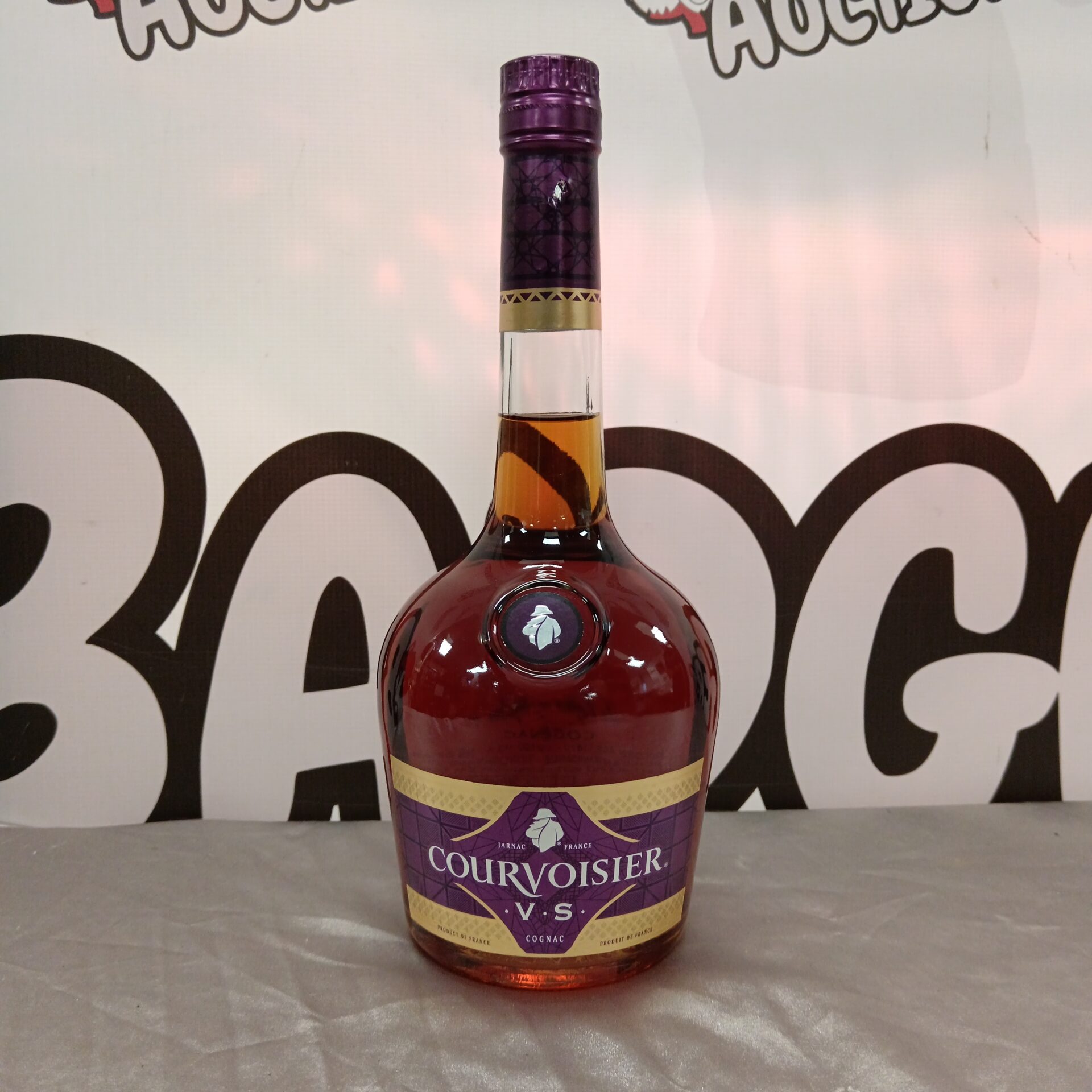 1087 Sealed bottle of courvoisier V S cognac