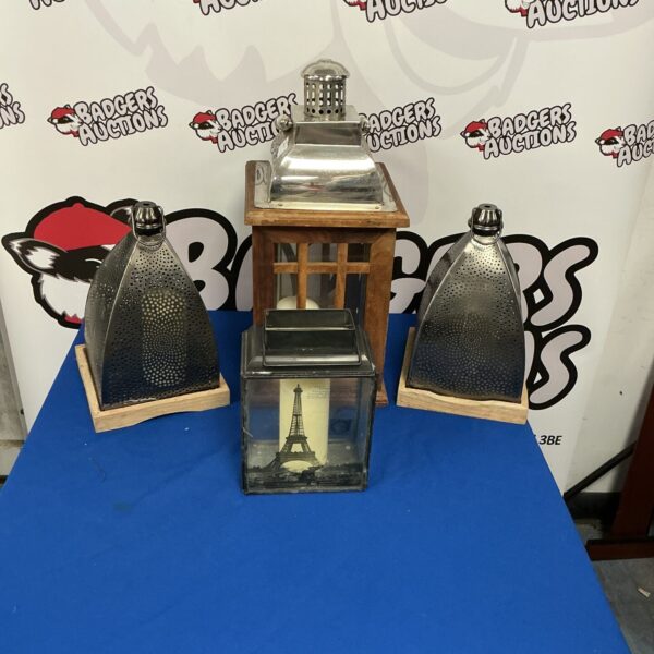 Group of four vintage decorative lanterns with candle holders.