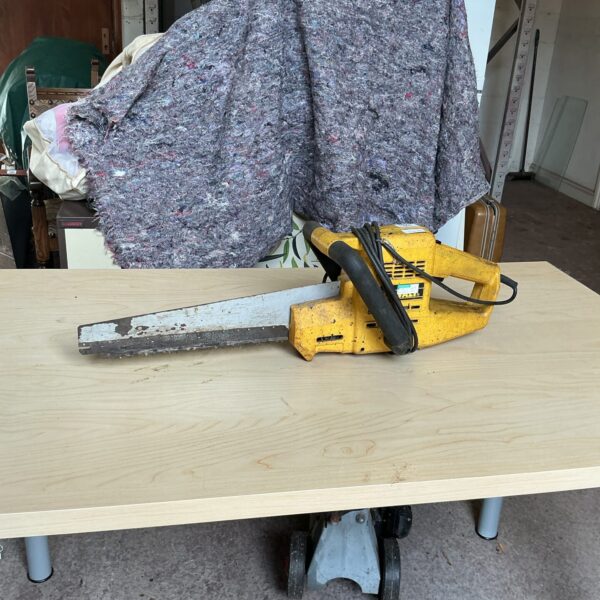 Vintage DeWalt circular power saw in used condition.