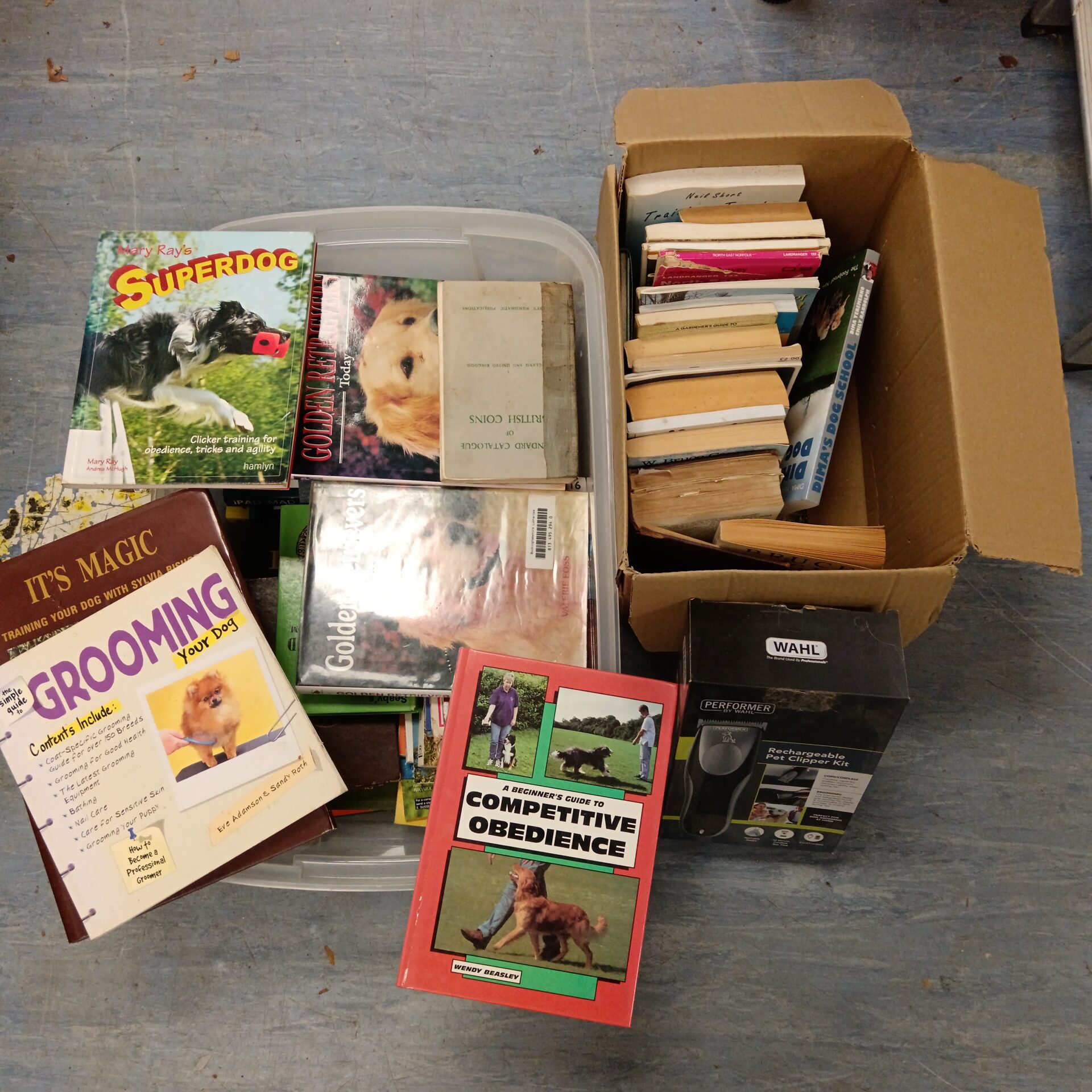757 Two boxes of dog training & grooming books with set of Wahl pet clippers