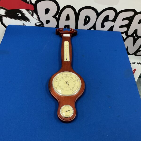Vintage French barometer with brass case and porcelain dial.