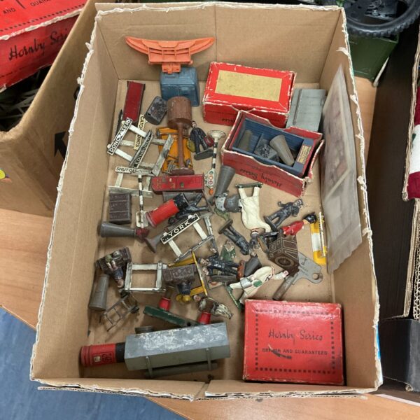 Vintage Hornby O gauge railway accessories in a box.