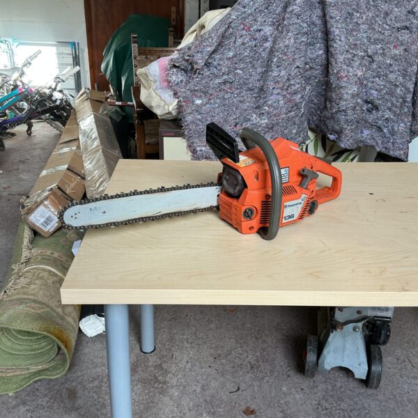 Used Husqvarna 136 petrol chainsaw for garden and DIY tasks.