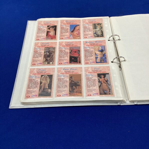Hustler trading card collection in protective folder.