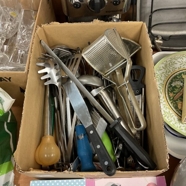 Mixed lot of stainless steel kitchen cutlery and utensils.