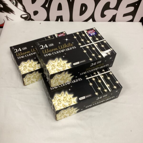 Box of 24 LED warm white star curtain lights.